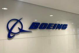Boeing shareholders keep outgoing CEO as board member